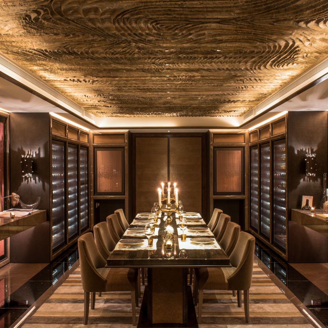 A dining room with elegant decor and candlelight for formal gatherings.